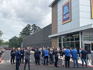 Guests wait for the grand opening of Aldi grocery store Thursday morning, April 25, 2024, at 2315 Richmond Road in Texarkana, Texas. Community members, city officials and Mayor Bob Bruggeman attended the ribbon-cutting as Texarkana welcomed its newest grocery store. Some in attendance had waited since 5 a.m. “We are really excited about having the privilege to service the customers here, and we think they are going to be really excited that we are here with great quality at great prices for the community,” Divisional Vice President Scott Huska said. (Staff photo by Sharda James)